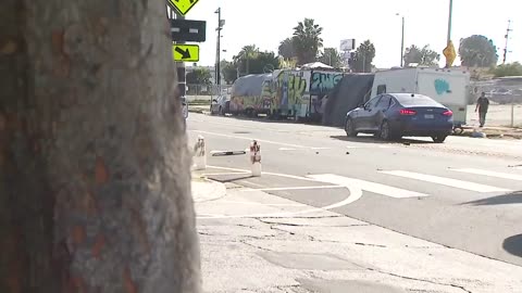 News report about dangerous LA intersection interrupted by car crash