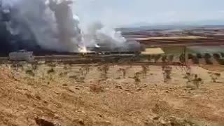 Syrian media reports explosions at a munitions depot at an air defense base near Hama