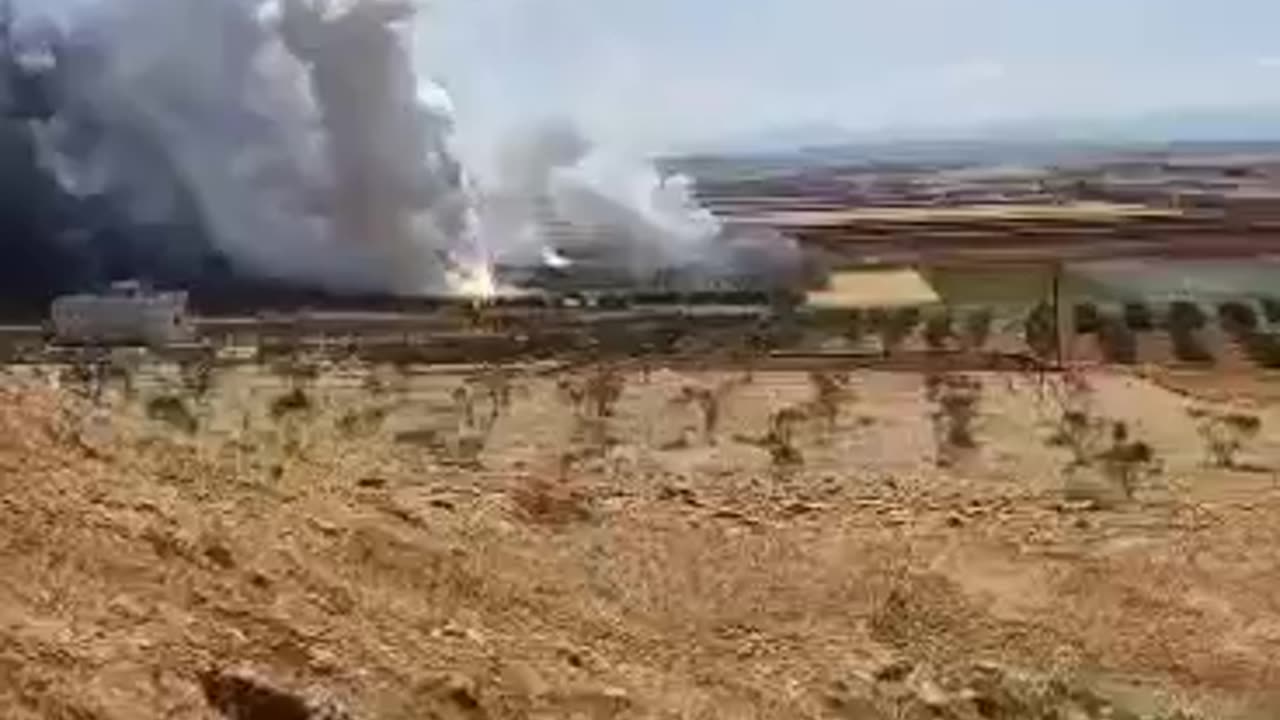 Syrian media reports explosions at a munitions depot at an air defense base near Hama