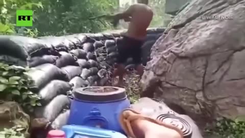 The Cambodian guy returning fire in shorts is awesome