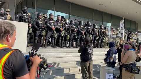 Fully armed force and national guards outside of federal government building...