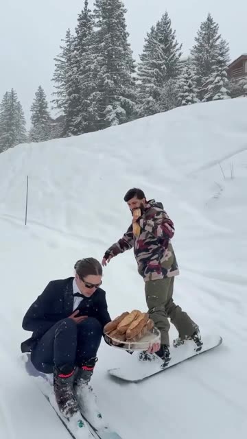 Arman Tsarukyan Falls While Eating on Snowboard
