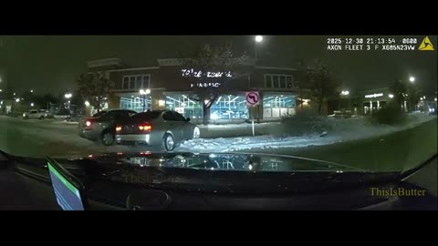 Dashcam shows suspect in a stolen BMW pushing a police cruiser before being pinned in a snow bank