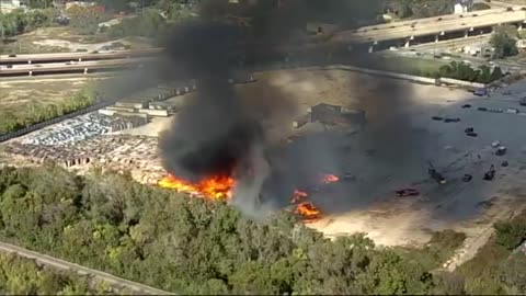 Dallas firefighters still battling large pallet fire