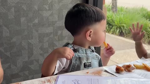 Adorable Kids Play Through Restaurant Window