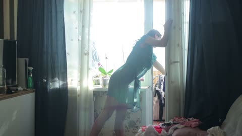 Transparent window cleaning with beautiful girl in dress