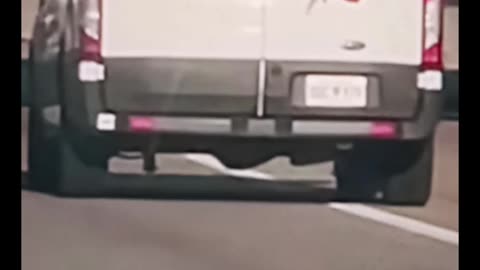 Oklahoma inmate hanging out of transport van