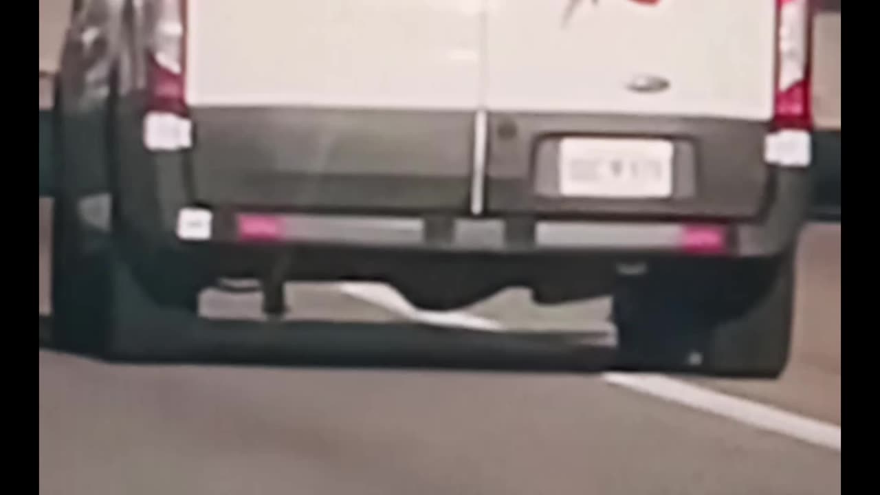 Oklahoma inmate hanging out of transport van