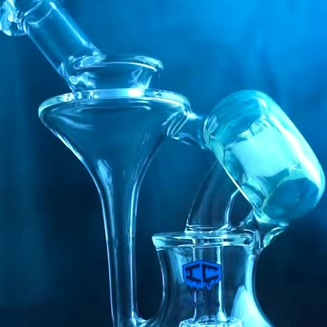 Ride the wave of flawless function with the IC Glass Donut Hole Recycler Rig!