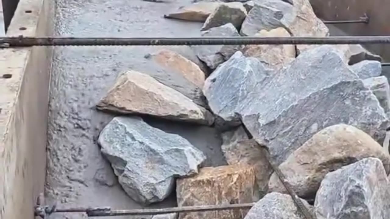Pouring Concrete Between Rocks
