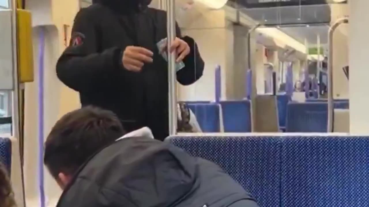 A German man protects a woman from an Arab who wants to beat her.