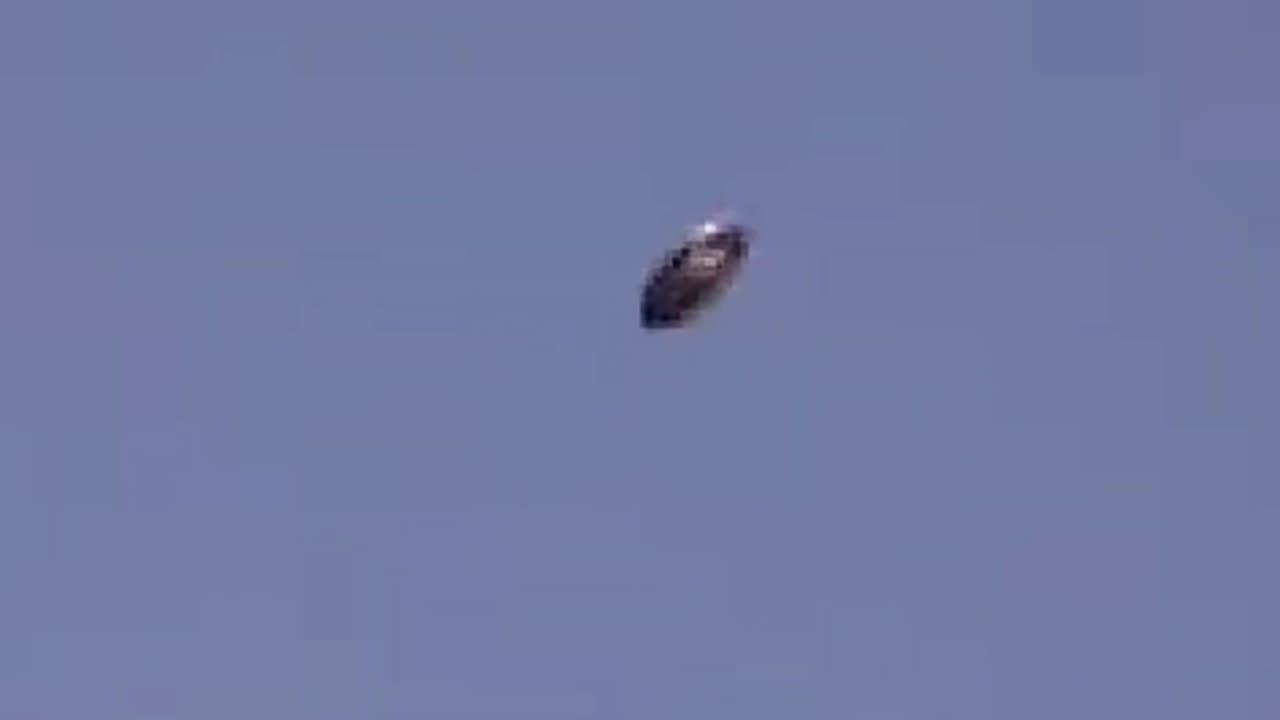 Disc-shaped UFO over Milan, Italy