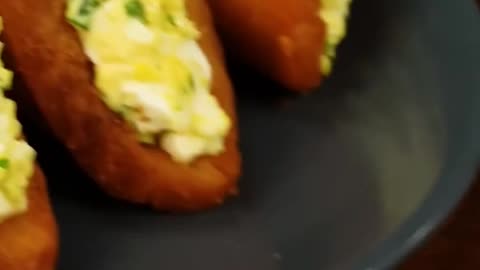 Crispy bread filled with eggs and mayo, fried cheese