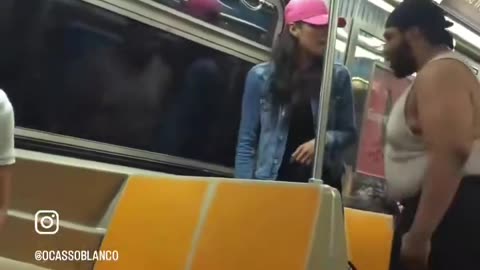 A black man targets a petite female and threatens to hurt her while another black man