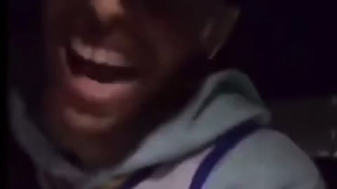 Man laughing in a car