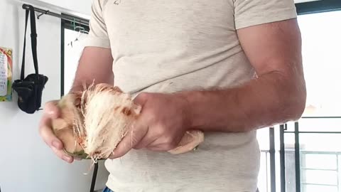 Breaking a coconut with my elbow