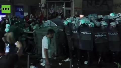 Serbian riot cops charge AFTER protesters kick and pelt them