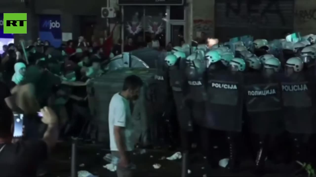 Serbian riot cops charge AFTER protesters kick and pelt them
