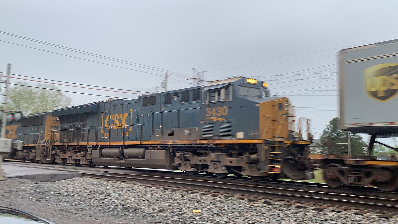 CSX Trains 4569 and 3430 light on cargo but big horn salute