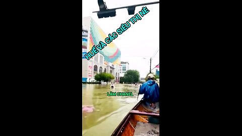 Hottest in Hue. Residents submerged in floodwater