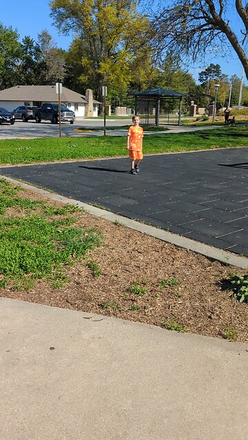 BradKuz76 Tomrik playing catch at the park.