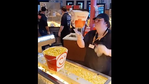 Man does "Cocktail" movie style tricks serving popcorn
