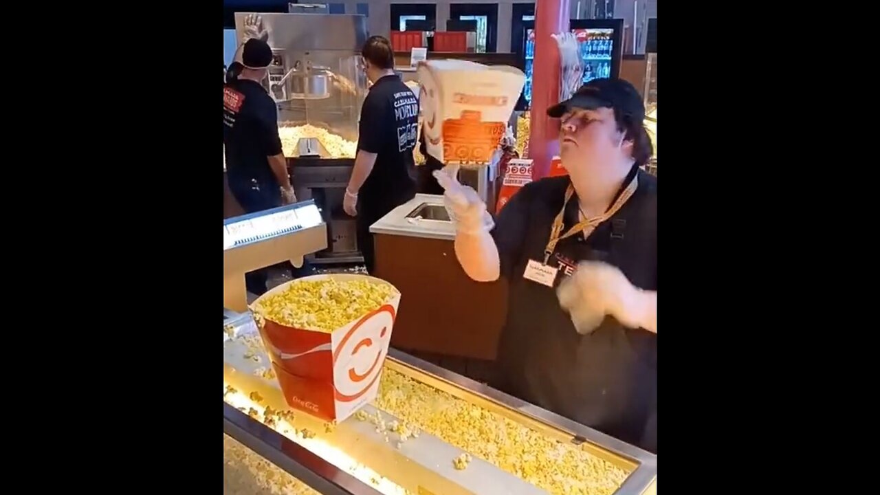 Man does "Cocktail" movie style tricks serving popcorn