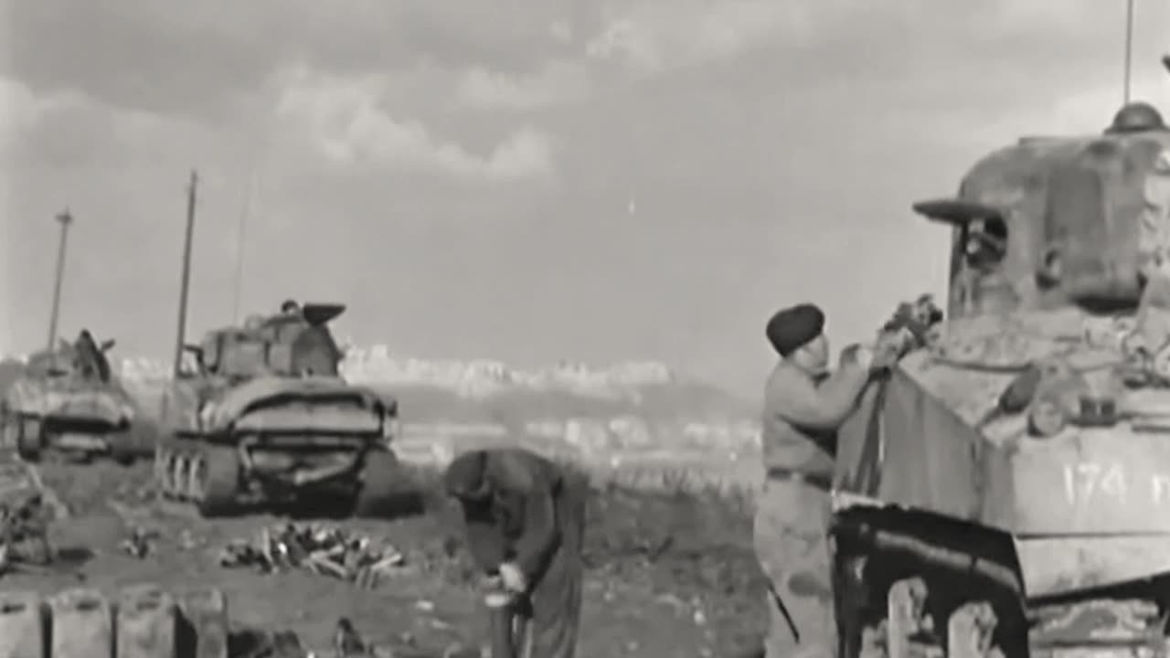 Canadian 17 pounder and Sherman tanks in action near the Italian town of Ortona in late 1943