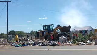 Graders cleaning the dumping site
