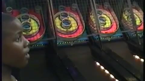 Family Enjoying Skeeball