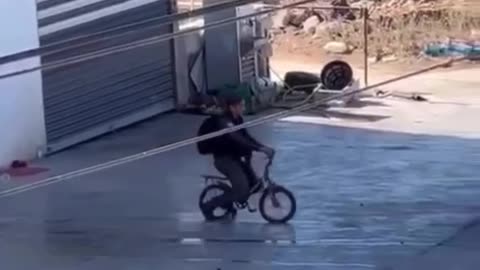 An Israeli female soldier was seen riding a Palestinian child’s bicycle after seizing it from the street during an Israeli army raid in the town of Kafr Qaddum, east of Qalqilya, today