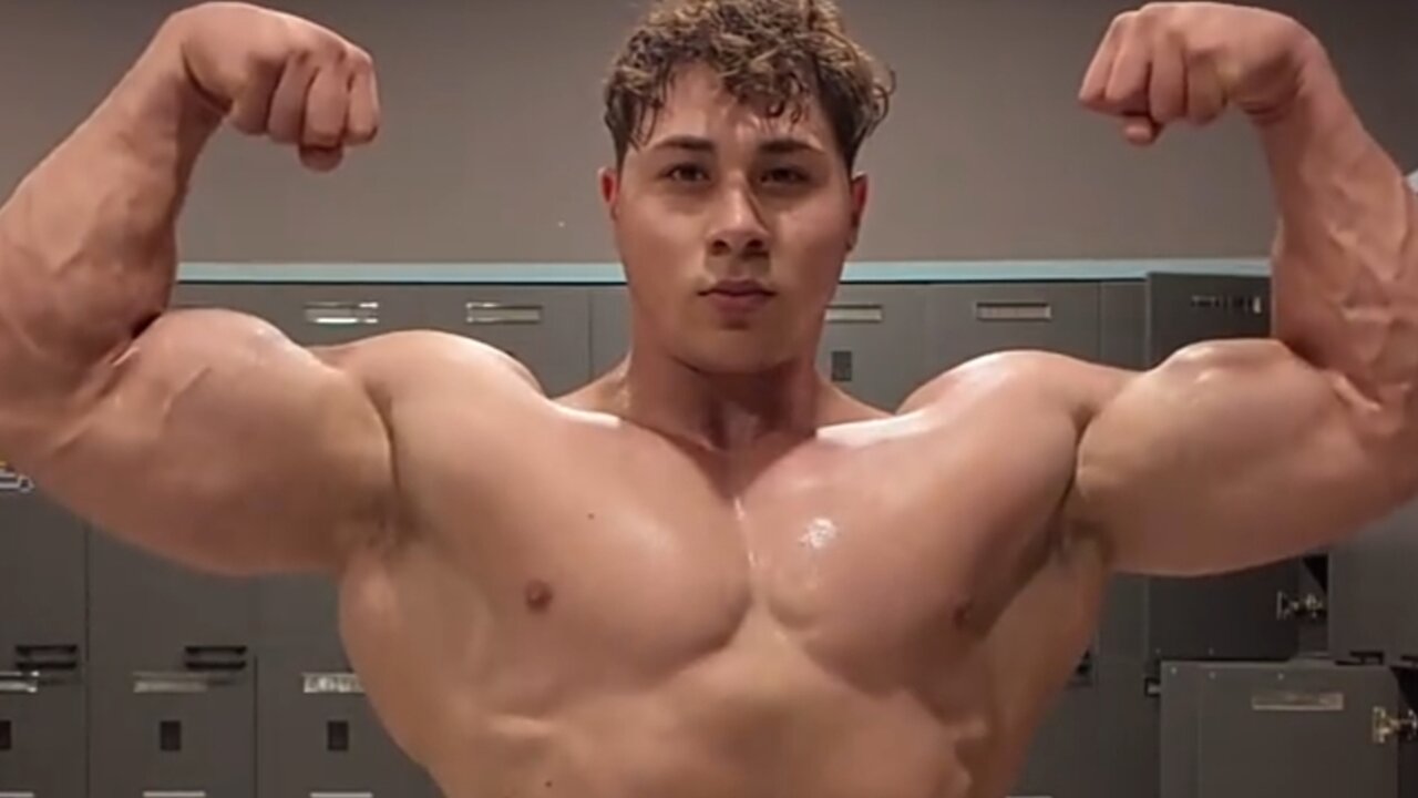 Young man flexing muscles