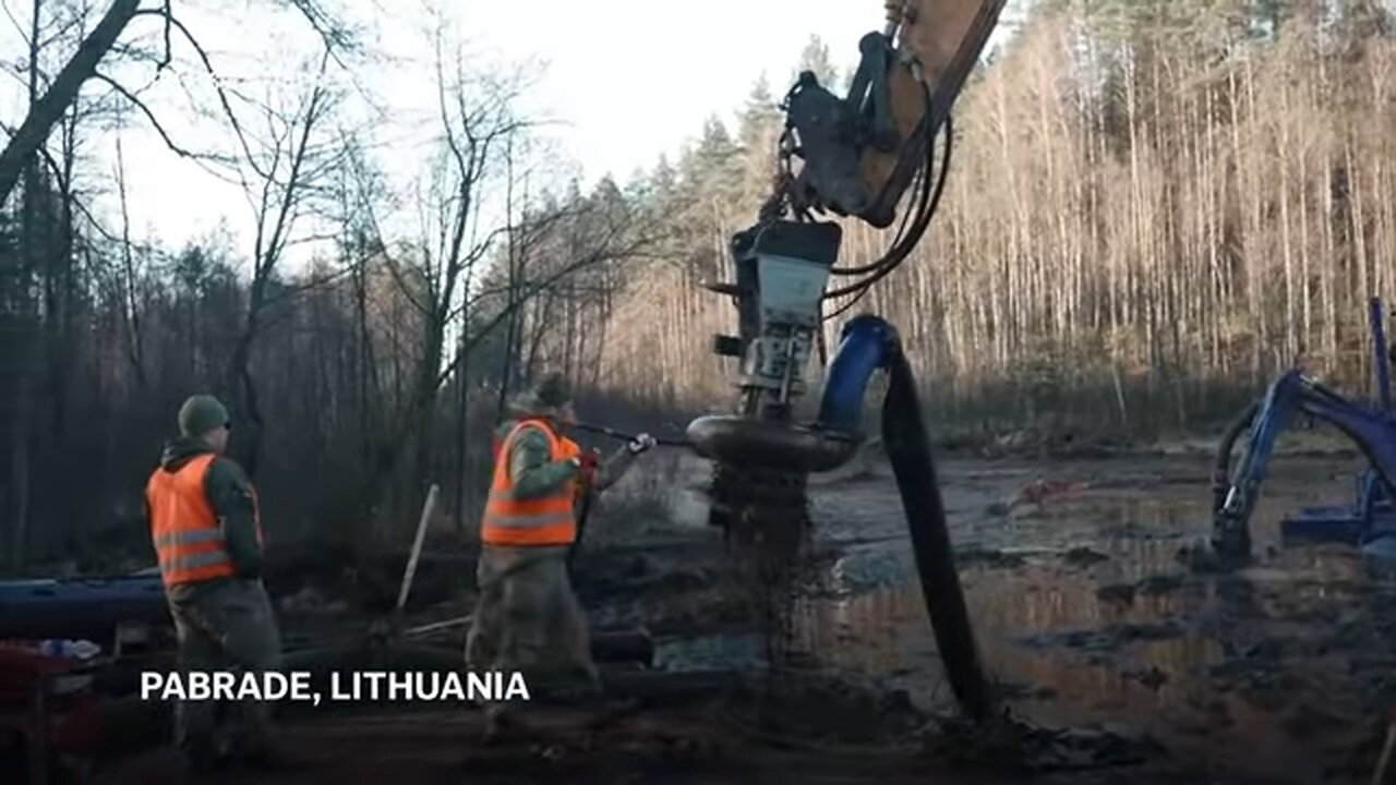 US and Lithuanian forces work to drain swamp to recover 4 soldiers in submerged armoured vehicle