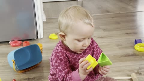 Baby Kayla Fully Focused on Her Toys