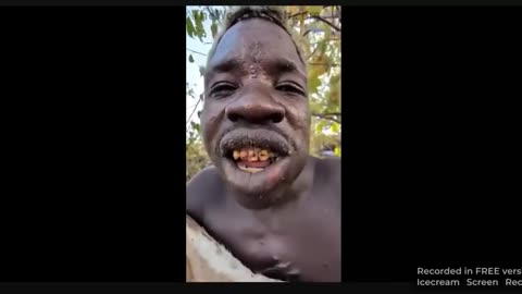 African negroid savage eats a dog