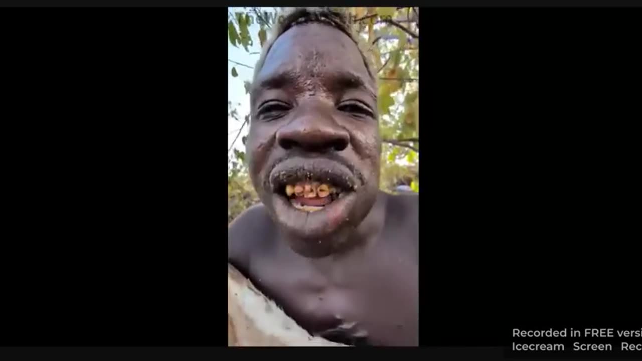 African negroid savage eats a dog