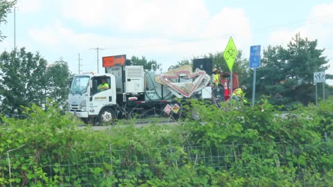 Road Crew picking up Cones