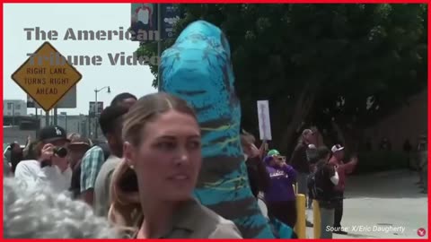 “Mental Health of These People Is NOT OK”: Protester in a Dinosaur Costume Harasses National Guard