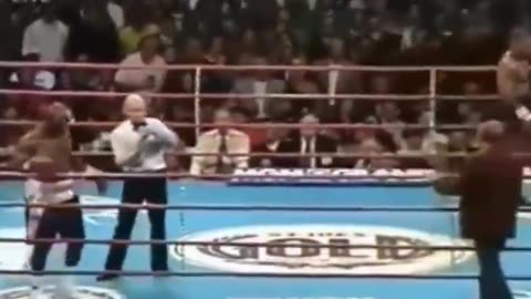 Mike Tyson biting Evander Holyfield's ear in 1997