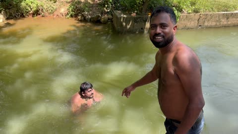 Bathing in water Kataragama