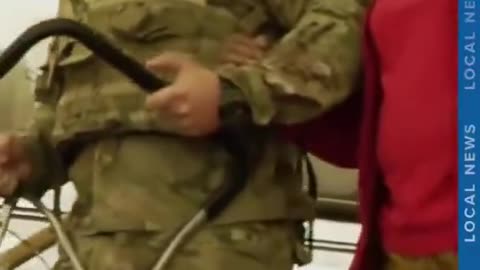 National Guard member helps woman down stairs in Washington, D.C.