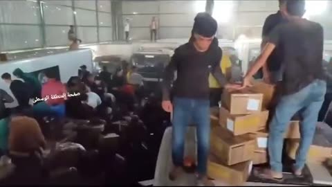Gaza residents storm a storage of humanitarian aid