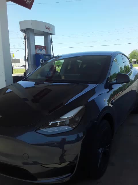 A TESLA at the Gas Pump