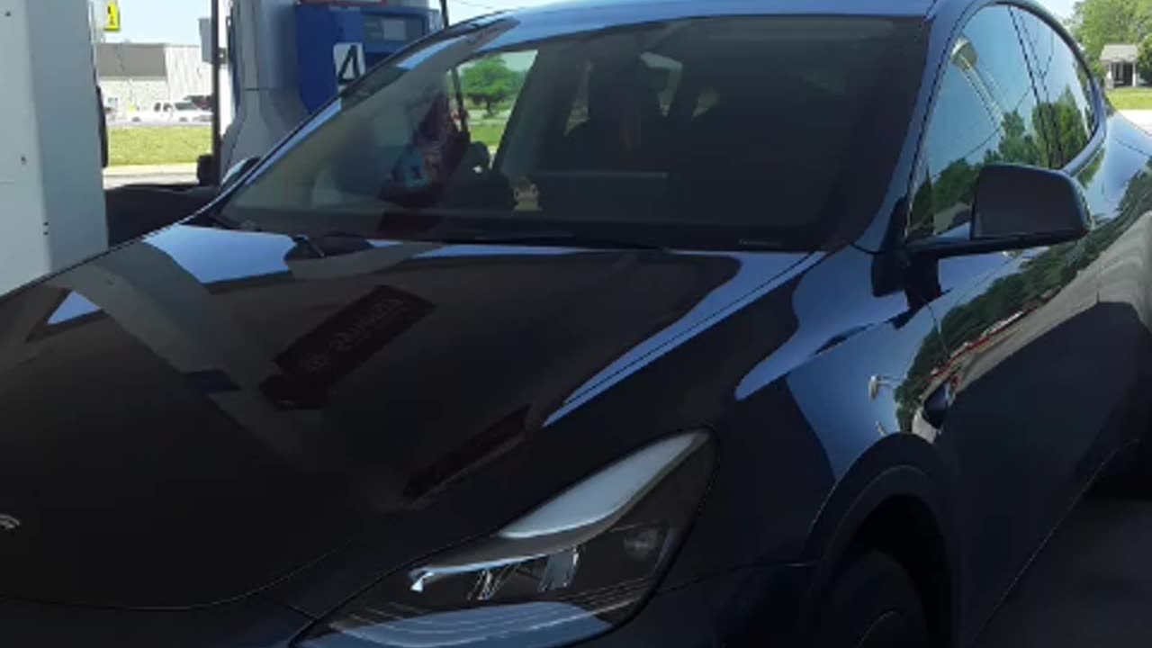 A TESLA at the Gas Pump