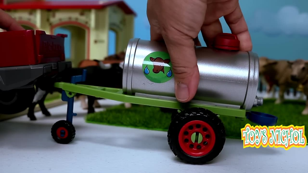 Green Tractor Carrying Grass and Straw for Buffalo Feed