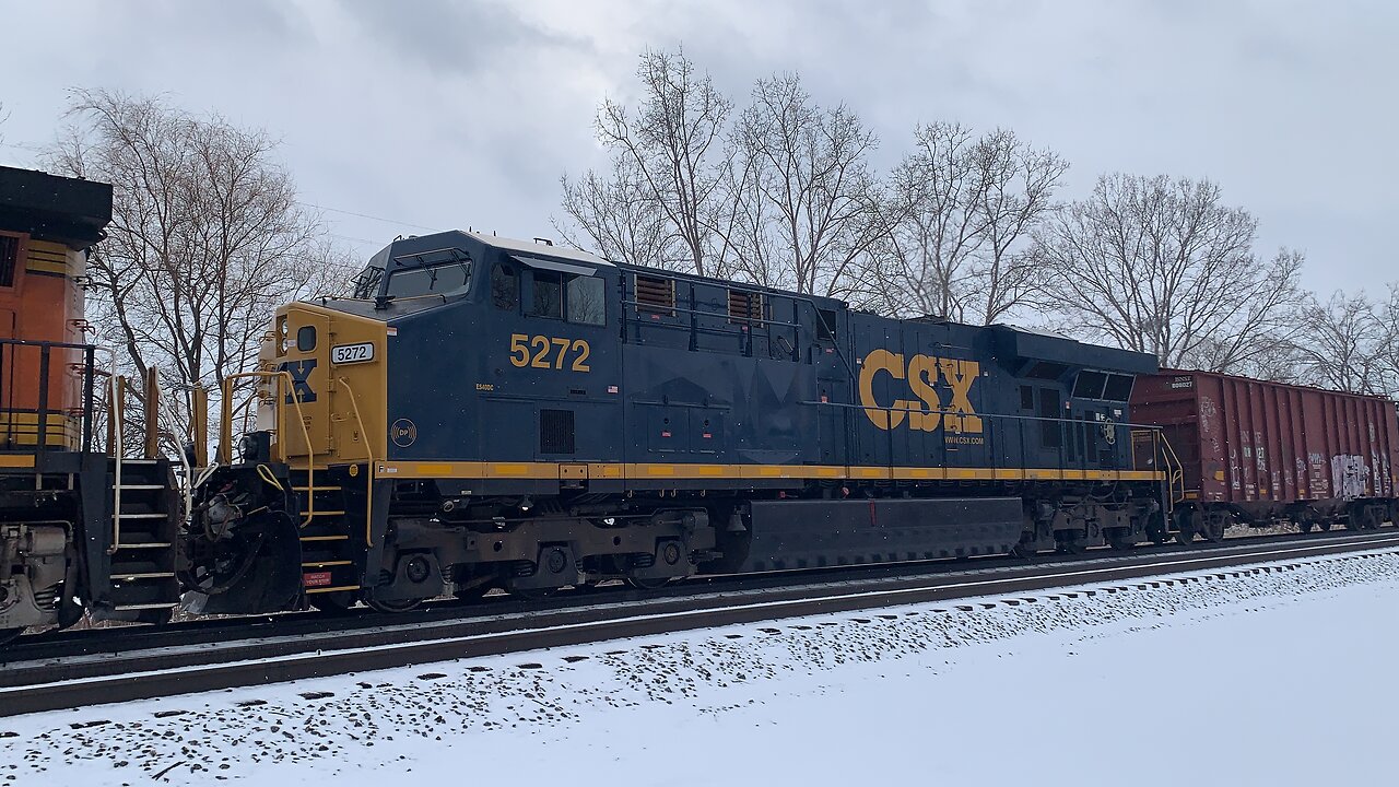 Dash 9 Coupled with a CSX pulling tankers