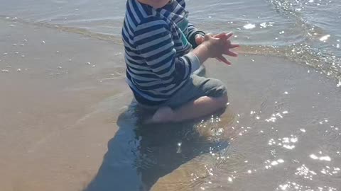 Little Radmehr playing on the shore of the Persian Gulf.