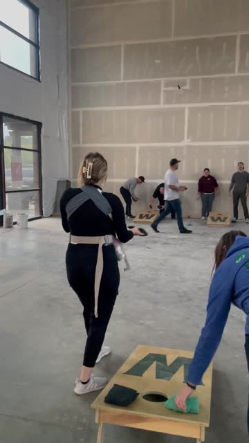 Multitasking Mom Nails Cornhole While Feeding Her Newborn