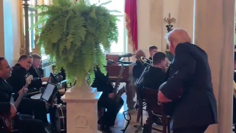 President Donald Trump stops to thank the US Navy Band Cruisers