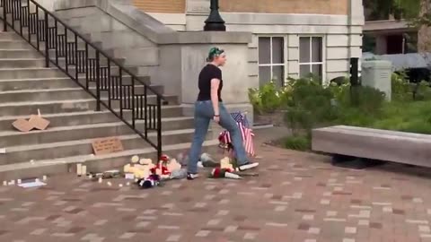 Woman attacks memorial for Charlie Kirk in Arkansas